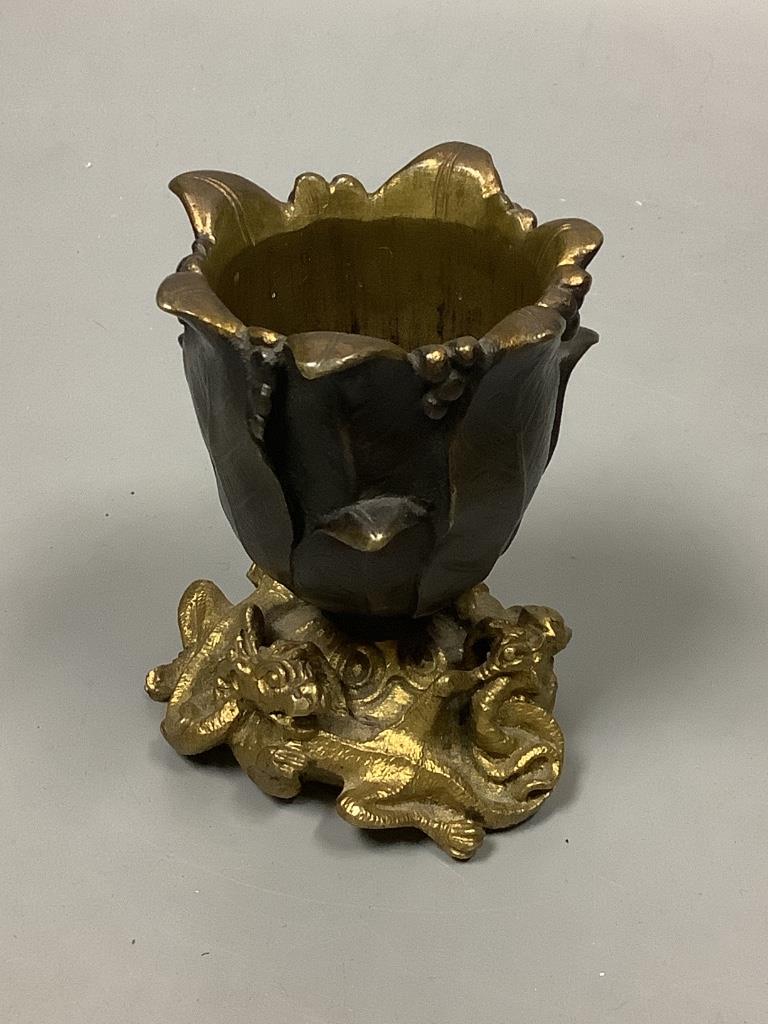 A small bronze 'tulip head' vase with gilt 'dragon' base, height 9cm